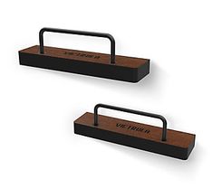 two black and brown wooden trays sitting on top of each other, one holding a handle