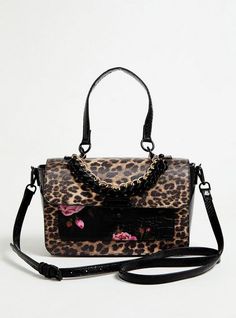 This satchel bag is looking pretty wild with its mixed prints (hello, leopard and roses). Features short and long straps for versatility, chain accents, and iconic Betsey Johnson touches. Turn-lock closure. 9. 5”L x 3. 75”W x 7. 5”H. 5. 5” handle drop . 58” Adjustable and removable crossbody strap. Inside pocket. Exterior slip pocket. Man-made materials. Imported. The best plus size women's betsey johnson leopard satchel bag handbags in multi made of pleather. Torrid is your destination for cozy Mixed Prints, Perfect Purse, Girly Bags, Girly Accessories, Beautiful Handbags, Black Purses, Satchel Bag, Cute Bags, Mixing Prints