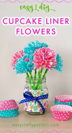 cupcake liner flowers in a mason jar with pink and blue paper muffins