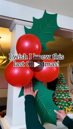 a woman is holding balloons in front of a christmas tree with the words, i wish i knew this last christmas