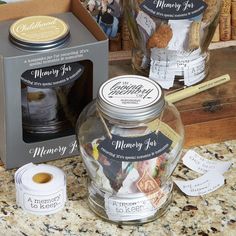 two jars filled with money sitting on top of a counter next to boxes and papers