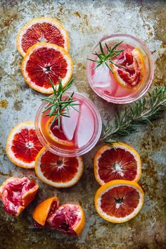 blood oranges and rosemary garnish in glasses