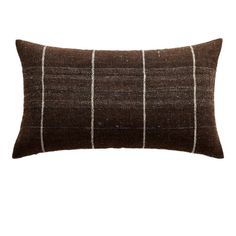 a brown and white striped pillow on a white background