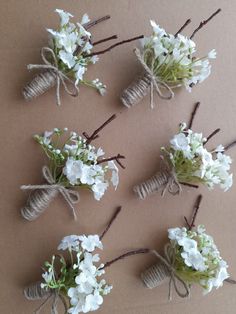 small white flowers tied together with twine and twine on brown paper sheeted surface