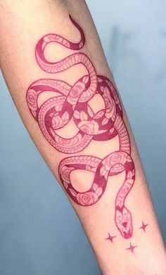 a woman's arm with a tattoo on it and a snake in the middle