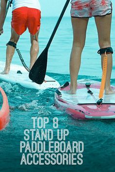 two people stand on paddle boards in the water