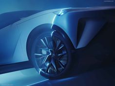 the front end of an electric car in blue light