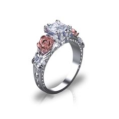 an engagement ring with two roses on the side and one rose in the middle, surrounded by diamonds