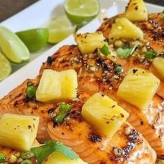 salmon with pineapple salsa on a white plate