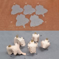 several pieces of white plastic with gold hardware on top and in the middle, there is an image of four horses that are facing different directions