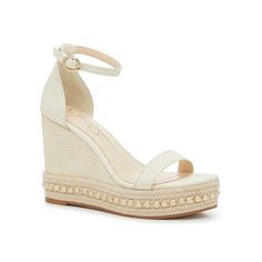 a women's wedged sandal with an open toe and ankle strap, in white