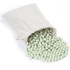 green and white candies spilling out of a bag