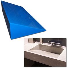 a blue triangular shaped object sitting on top of a counter next to a bathroom sink