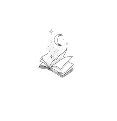 an open book with a crescent and stars on it, sitting in front of a white background