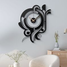 a clock that is on the wall next to a chair