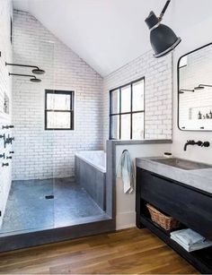 a bathroom with a sink, mirror and bathtub