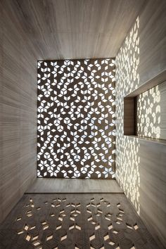 the inside of a building with geometric designs on it's walls and flooring