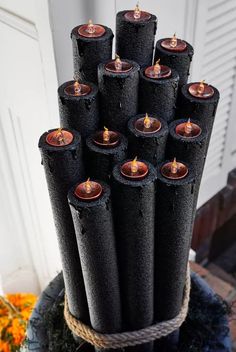 a bunch of candles that are sitting on a table