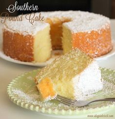 a piece of pound cake on a plate with a fork next to it and the rest of the cake in the background