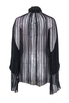 Get ready to rock any occasion in this semi-sheer black blouse with metallic details from IRO. Perfectly pairs with leather leggings and heeled boots for a chic and edgy look. So versatile, you'll want to wear it everywhere! Size 2 (FR 34) 64% Viscose, 35% Cupro, 1% Metallized Fiber Unlined V-neckline detail Long sleeve Semi sheer Bust 62" Waist 65" Shoulder to hem 32" Sleeve length 29" Sheer Sleeve Tops For Evening In Winter, Sleek Sheer Tops For Party, Sheer Evening Tops For Winter, Sheer Evening Blouse For Fall, Sheer Blouse For Evening Wear In Fall, Fall Evening Sheer Blouse, Sleek Winter Party Tops, Sheer Black Blouse For Fall, Sheer Sleeves Evening Tops For Party Season