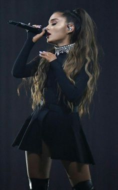 aria performs on stage at the brity awards in london, england during her performance