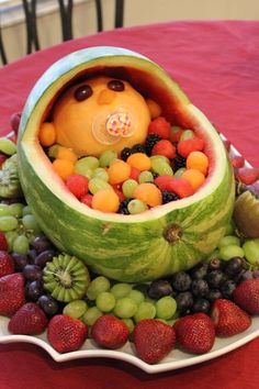 a watermelon shaped like a bear with fruit in it