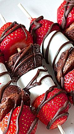 chocolate covered strawberries and marshmallows on a stick