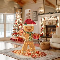 an inflatable gingerbread man is on the living room floor with christmas lights