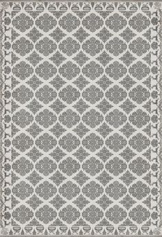 a gray and white rug with an intricate design