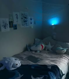 a bed room with a neatly made bed and stuffed animals