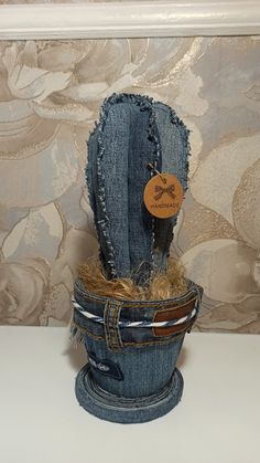 a denim cactus planter with a tag on it