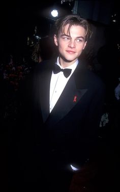 a young man in a tuxedo and bow tie