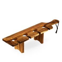 a wooden bench with four pieces of wood on the top and one piece cut out