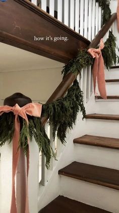 the stairs are decorated with garland and bows