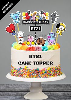 a birthday cake with lots of stickers on it's top and the words bt2