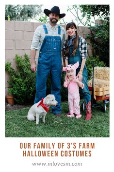 a man and woman standing next to a small child in front of a pig costume