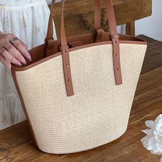 Add a summer-inspired touch to your accessories edit with this straw bucket tote bag. Woven from straw with leather trimmings, this handbag makes us look forward to summer and escapism. It comes with an open top and is roomy enough for all your essentials. Easy-to-wear wardrobe staples that combine classic and contemporary styles.Width (cm): 28 cmHeight (cm): 16 Color: Light brownInterior Material: Polyester CottonMaterial_bag: StrawBagType: Handbag & Shoulder bagBag Length: 28 cm Natural Shoulder Bag With Bamboo Handle For Shopping, Chic Straw Bag With Bamboo Handle For Everyday, Top Handle Straw Shopping Bag, Straw Top Handle Shopping Bag, Chic Daily Use Straw Bag With Bamboo Handle, Natural Straw Shopping Bag With Top Handle, Chic Double Handle Beach Bag With Bamboo Handle, Beige Top Handle Beach Bag With Leather Handles, Natural Top Handle Straw Bag For Shopping