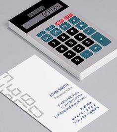 a calculator on top of a business card