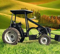 a tractor is parked in the middle of a green field with rolling hills behind it