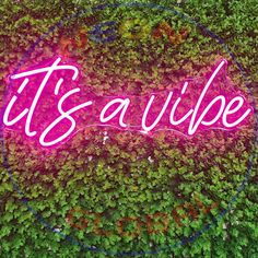 a neon sign that says it's savibe on the side of a wall