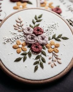 a close up of some embroidery on a table