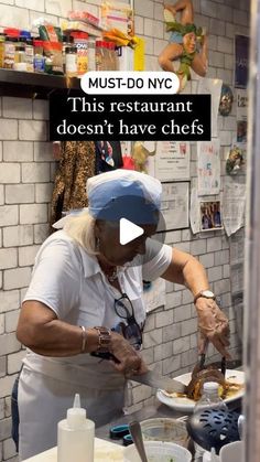 a woman in white shirt and blue hat preparing food