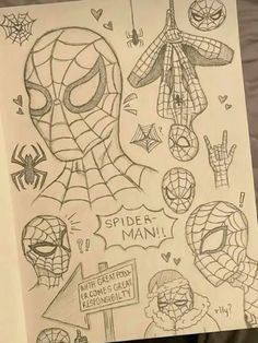 someone is holding up a drawing with spider man and other things on it in front of them