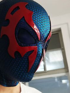 a man wearing a blue and red mask