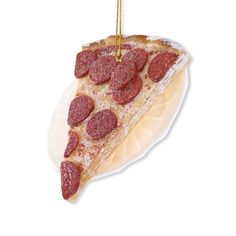 a slice of pepperoni pizza hanging from a string