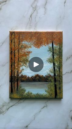 an image of a painting on a marble surface with the words, autumn is here