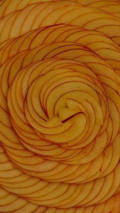 an apple spiral is shown in this close up photo