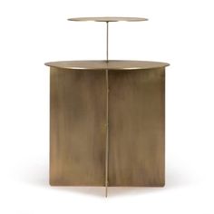 a round table with a metal stand on it's side, against a white background