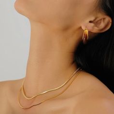 Turn heads with our Juniper Square Snake Chain Necklace! Its 18K gold plating adds a touch of luxury, while its simple and fashionable design is easy to match and layer with any style. Soft to the touch, this necklace is the perfect accessory to elevate any look. To keep your jewellery in the best condition, we recommend giving it a good care over time. By using a soft, lint-free jewellery cloth, you can remove blemishes that result from body oils, perfumes and lotions. Also remember try not to expose your jewellery in the open air. Our branded dusty bag or your jewellery box will keep them last longer. If you go to gym or spa, remember to take them off, because water or sweat will also damage them. Go To Gym, Blemish Remover, Snake Chain Necklace, Body Oils, Pearl Design, Necklace Sizes, Large Fashion, Gold Plated Silver, Open Air