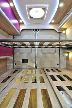 the interior of a vehicle with wooden flooring